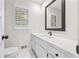 Elegant powder room featuring a modern vanity, hexagon tile flooring, and updated fixtures at 3009 Gant Quarters Dr, Marietta, GA 30068