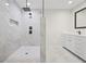 Modern bathroom featuring a large walk-in shower with marble tiling and sleek fixtures and vanity at 3009 Gant Quarters Dr, Marietta, GA 30068