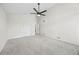 A spacious bedroom features a ceiling fan, neutral walls, gray carpet, closet and white door at 3009 Gant Quarters Dr, Marietta, GA 30068