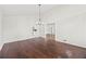 Spacious dining room featuring hardwood floors and an open layout leading to the kitchen at 3009 Gant Quarters Dr, Marietta, GA 30068
