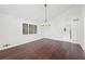 Open dining room featuring hardwood floors, modern lighting, and ample natural light from the windows at 3009 Gant Quarters Dr, Marietta, GA 30068