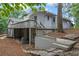 Exterior of the home featuring a spacious deck, patio, and landscaped yard at 3009 Gant Quarters Dr, Marietta, GA 30068