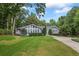 Charming one-story home with a well-manicured lawn, beautiful landscaping, and a long driveway at 3009 Gant Quarters Dr, Marietta, GA 30068