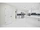 A well-lit kitchen features white cabinets, stainless steel appliances, and hexagon tile flooring at 3009 Gant Quarters Dr, Marietta, GA 30068