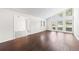 A large living room featuring hardwood floors, white walls, and lots of natural light at 3009 Gant Quarters Dr, Marietta, GA 30068
