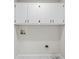 Above storage with white doors and matte black hardware in laundry room at 3009 Gant Quarters Dr, Marietta, GA 30068