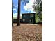 Exterior view of the home's backyard with mature trees at 354 Dublin Way, Lawrenceville, GA 30044