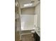 Bathroom with skylight and white tiled shower-tub combo at 354 Dublin Way, Lawrenceville, GA 30044