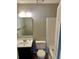 Bathroom with a single sink vanity and tiled shower at 354 Dublin Way, Lawrenceville, GA 30044