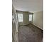 Spacious bedroom with two windows and a textured ceiling at 354 Dublin Way, Lawrenceville, GA 30044
