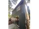 Home exterior shows a sliding glass door, a window, and durable siding on the side of the home at 354 Dublin Way, Lawrenceville, GA 30044