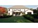 Expansive backyard with a covered patio, featuring mature trees and lush green lawn at 3680 Tanglewood Se Dr, Atlanta, GA 30339