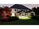Gorgeous backyard with a covered patio, lush lawn, mature trees, and professional landscaping at 3680 Tanglewood Se Dr, Atlanta, GA 30339
