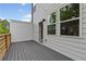 Spacious wooden deck overlooking the backyard and mature trees accessible from the main living area at 586 Avondale Park Cir, Decatur, GA 30032