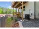 Backyard porch area with a wooden staircase and black gravel at 586 Avondale Park Cir, Decatur, GA 30032