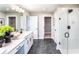 Modern bathroom with dual sinks, sleek black fixtures, and glass-enclosed shower offers a spa-like experience at 586 Avondale Park Cir, Decatur, GA 30032
