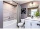 Well-lit bathroom with tub/shower combo, modern vanity, and stylish fixtures offers a functional and relaxing space at 586 Avondale Park Cir, Decatur, GA 30032