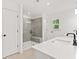 Bright bathroom with a walk-in shower, and double sink vanity at 586 Avondale Park Cir, Decatur, GA 30032