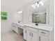 Spacious bathroom featuring a dual sink vanity and a view of the walk-in shower at 586 Avondale Park Cir, Decatur, GA 30032