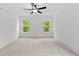 Light bedroom with lush, green outdoor views at 586 Avondale Park Cir, Decatur, GA 30032