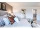 Comfortable bedroom featuring a bed with decorative pillows and a cozy chair, providing a relaxing atmosphere at 586 Avondale Park Cir, Decatur, GA 30032
