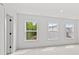 Bright bedroom with three windows offering natural light and green views at 586 Avondale Park Cir, Decatur, GA 30032
