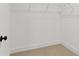 Walk-in closet with built-in shelving offering ample storage space at 586 Avondale Park Cir, Decatur, GA 30032
