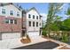 Newly constructed townhome with a one-car garage and professionally landscaped front yard at 586 Avondale Park Cir, Decatur, GA 30032