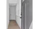 Hallway with laminate floors and white walls at 586 Avondale Park Cir, Decatur, GA 30032