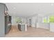 Open concept home with kitchen, living area and staircase. Kitchen features an island and stainless appliances at 586 Avondale Park Cir, Decatur, GA 30032