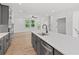 Modern kitchen with stainless steel appliances, gray cabinetry and a center island with a quartz countertop at 586 Avondale Park Cir, Decatur, GA 30032