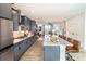 Modern kitchen featuring stainless steel appliances, a large island, and gray cabinetry at 586 Avondale Park Cir, Decatur, GA 30032