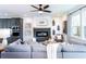 Open-concept living room with a modern fireplace and comfortable gray sofa at 586 Avondale Park Cir, Decatur, GA 30032