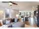 Open concept living area with a comfortable gray sofa, modern decor, and seamless flow to kitchen and dining spaces at 586 Avondale Park Cir, Decatur, GA 30032