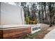 Avondale Park signage with stone wall, wood detail and landscaping at 586 Avondale Park Cir, Decatur, GA 30032
