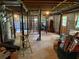 Unfinished basement with exposed wooden ceiling beams, support poles, and cement walls at 1046 Waterside Se Dr, Conyers, GA 30013