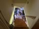View of wood stairs leading down to a unfinished basement area at 1046 Waterside Se Dr, Conyers, GA 30013