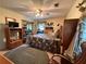 Bedroom with carpet, mirrored closet, ceiling fan, TV and natural lighting at 1046 Waterside Se Dr, Conyers, GA 30013
