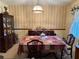 Classic dining area with a large table, decorative wallpaper, and elegant furnishings at 1046 Waterside Se Dr, Conyers, GA 30013