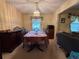 Formal dining room featuring a table set for six, traditional decor, and carpet floors at 1046 Waterside Se Dr, Conyers, GA 30013