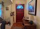 Inviting entryway with a wood door, charming decor, and a warm, welcoming ambiance at 1046 Waterside Se Dr, Conyers, GA 30013