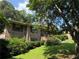 Street view of a single-story brick home with mature landscaping and classic architectural details at 1046 Waterside Se Dr, Conyers, GA 30013