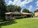 Charming brick home with a well-manicured lawn and an attached carport at 1046 Waterside Se Dr, Conyers, GA 30013