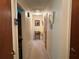 Clean hallway with neutral carpet and fresh paint leading to additional rooms at 1046 Waterside Se Dr, Conyers, GA 30013