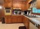 Functional kitchen with wooden cabinets and bright countertops and an electric oven at 1046 Waterside Se Dr, Conyers, GA 30013