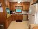 Functional kitchen with wooden cabinets and bright countertops and an electric oven at 1046 Waterside Se Dr, Conyers, GA 30013