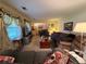 Inviting living room with comfortable sofas, large windows, and neutral colors throughout at 1046 Waterside Se Dr, Conyers, GA 30013
