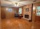 Cozy room with a brick fireplace, wood-paneled walls, and a classic, comfortable design at 1046 Waterside Se Dr, Conyers, GA 30013