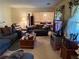 Cozy living room featuring plush seating, carpet flooring, and natural light at 1046 Waterside Se Dr, Conyers, GA 30013