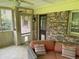 Comfortable screened porch with brick accents, fan, and access to the backyard at 1046 Waterside Se Dr, Conyers, GA 30013